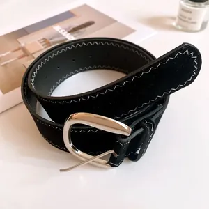 Black suede leather belt with silver buckle and white zigzag stitching details for women.