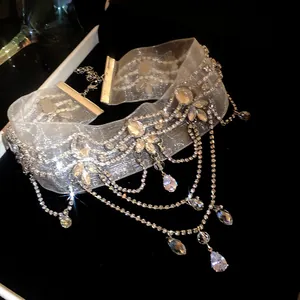 Close-up of an elegant rhinestone choker necklace with sparkling teardrop crystals
