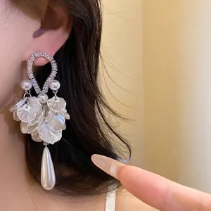 Elegant zircon and pearl flower petal drop earrings featuring a large water drop pendant