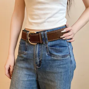 Brown leather belt for women with white zigzag stitching and a classic metal pin buckle