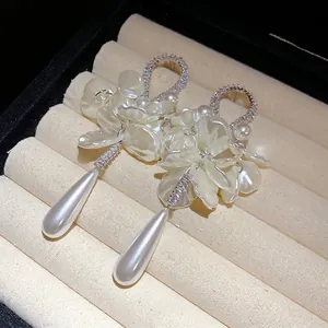 Elegant zircon pearl petal teardrop earrings with silver needles and luxury design.
