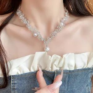 Close-up of French design beaded lace choker with elegant pearl pendant details for women