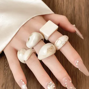 Detailed close-up view of vintage ins style resin rings with elegant marbled patterns