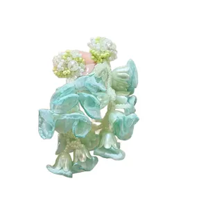 Elegant mint green chiffon flower tassel earrings with pearls and beads for spring wear