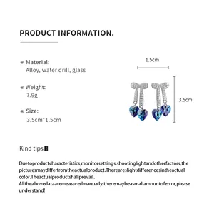 Product details for silver bowknot earrings with blue heart crystals and dimensions