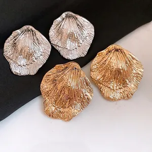 Elegant minimalist metallic pleated leaf stud earrings in gold and silver finishes for women
