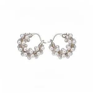 Elegant 18k gold plated hoop earrings featuring white pearls and sparkling cubic zirconia