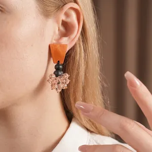 Vintage ethnic style tassel earrings with warm wooden blocks and pink glass beads