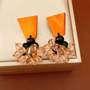 Vintage orange wood and champagne glass bead tassel earrings with silver needle