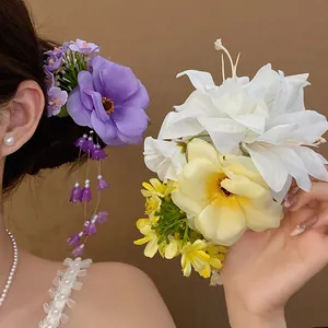 Elegant fabric floral hair clip with delicate pearl tassel detail for a sweet feminine look