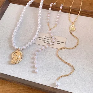 Elegant seashell pearl pendant necklaces for beach vacations and layered jewelry look