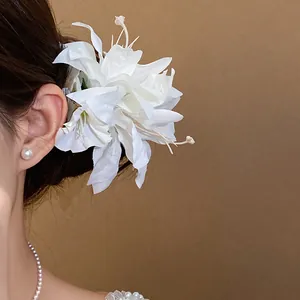 Elegant large white fabric flower hair clip with pearl accents for women, wedding style
