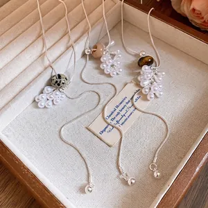 Elegant adjustable necklace featuring water-drop pearls and natural stones on snake chains