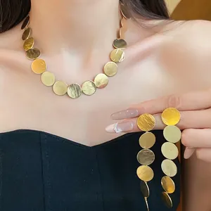 Gold metal round disc jewelry set including necklace and earrings for women