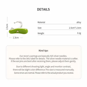 Detailed macro view showing dimensions and materials of green enamel ear cuff