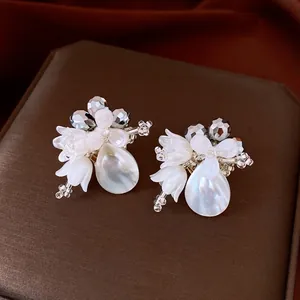 Elegant white flower shell waterdrop earrings with faceted crystal beads for women.