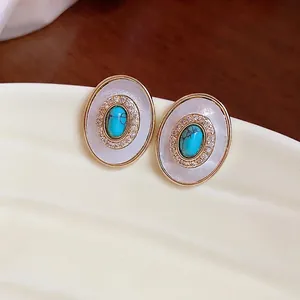 Vintage oval stud earrings featuring mother of pearl, sparkling zircon and turquoise.