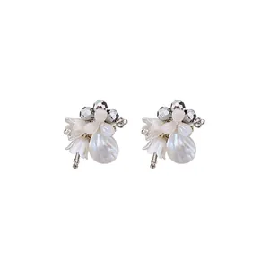 Elegant shell pearl flower drop earrings with crystal accents in vintage luxury style.