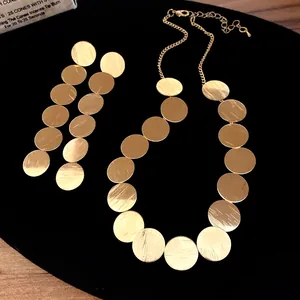 Elegant brushed gold circular metal necklace and earrings jewelry set for women