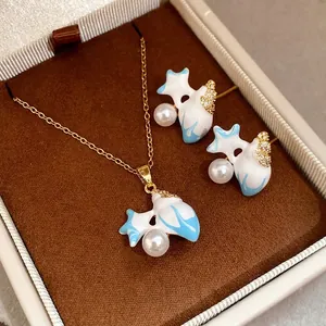 Elegant retro starfish jewelry set featuring zircon, pearl, and blue enamel in a premium gift box