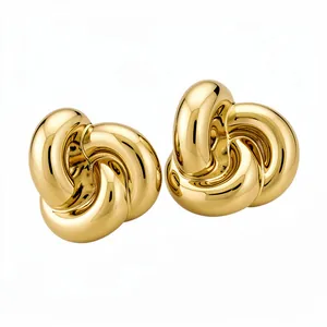 Elegantes pendientes de botón en metal dorado con diseño de flor retorcida vintage