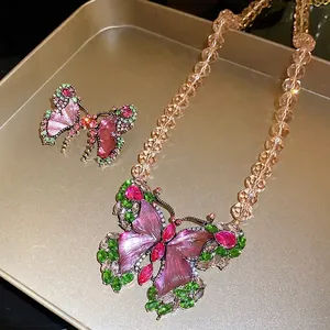 Vintage butterfly necklace and earring set with purple resin and crystal accents