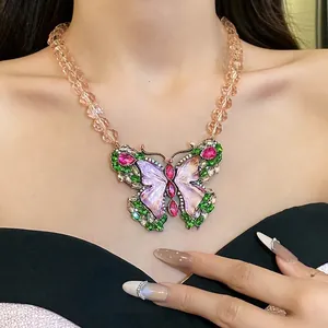 Vintage resin butterfly pendant necklace with colorful rhinestones on a beaded chain
