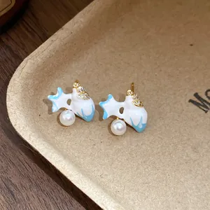 Close-up detail of vintage style starfish earrings with pearls and zircons