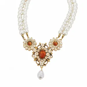 Elegant double-strand resin pearl necklace with vintage gold floral pendant and amber stone