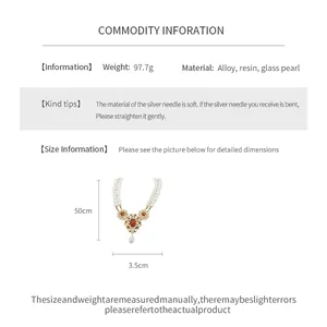 Detail view of vintage double-layer resin pearl necklace showing weight and size