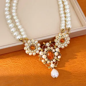 Vintage palace style double-layer resin pearl necklace with elegant amber floral pendant detail