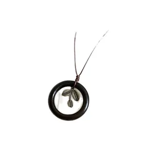 Retro Neo-Chinese style wooden circle necklace with metallic leaf pendant for women.
