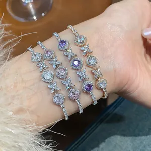 Detailed view of elegant rhombic flower zircon bracelets displayed on a female wrist.