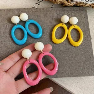 Vibrant dopamine style resin oval stud earrings in pink, blue, and yellow colors