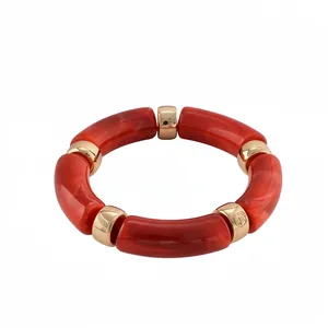 Red marbled acrylic elastic bracelet with polished gold-toned metal accents
