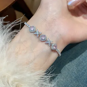 Close-up detail of a French style zircon bracelet featuring pink flower and rhombic patterns