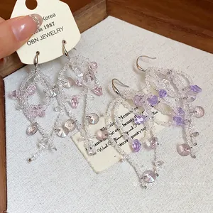 Elegant handmade glass beaded bow tassel drop earrings for women in pink and purple colors