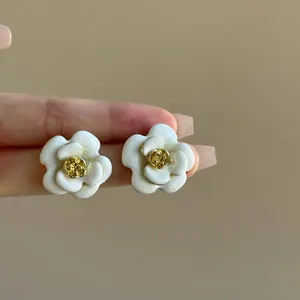 Elegant cream white oil-dripped camellia flower stud earrings with gold center detail