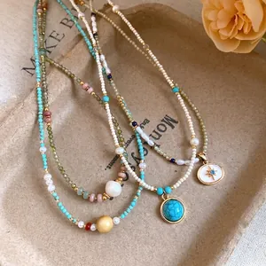 Exquisite vintage beaded stone necklace set featuring turquoise and pearl star pendants