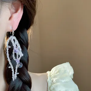 Elegant glass beaded tassel dangle earrings with purple crystal details for women.