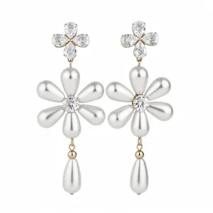 Elegant flower-shaped drop earrings featuring white pearls and sparkling zircons design