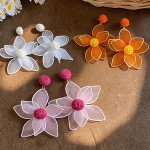 Elegant Bohemian hollow mesh flower earrings for summer beach style with raffia centers