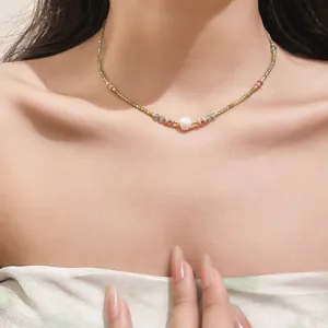 Detailed close-up view of an elegant vintage beaded choker featuring a central pearl.