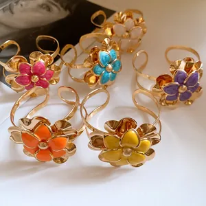 Detailed macro shot of vintage enamel double-layer flower bangles in various colors
