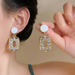 Vintage gold rectangular earrings encrusted with sparkling crystals for a luxurious look.