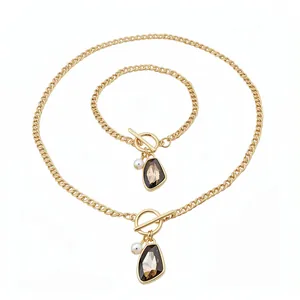 Elegant vintage gold chain jewelry set with irregular crystal and pearl pendants