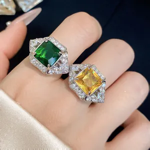 Detailed close-up view of elegant square emerald and citrine zircon rings in a silver setting