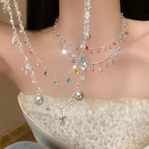 Detail view of double-layer necklace featuring colorful rhinestones, shells and starfish.