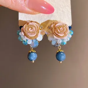 French vintage style earrings with resin pink roses, blue beads, and white pearls.