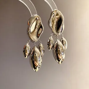 Irregular geometric silver dangle earrings with shiny metallic liquid-metal finish